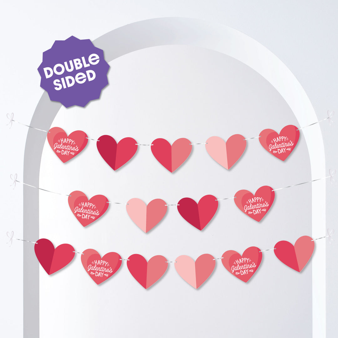 Galentine’s Day banner with red and pink hearts hanging on doorway