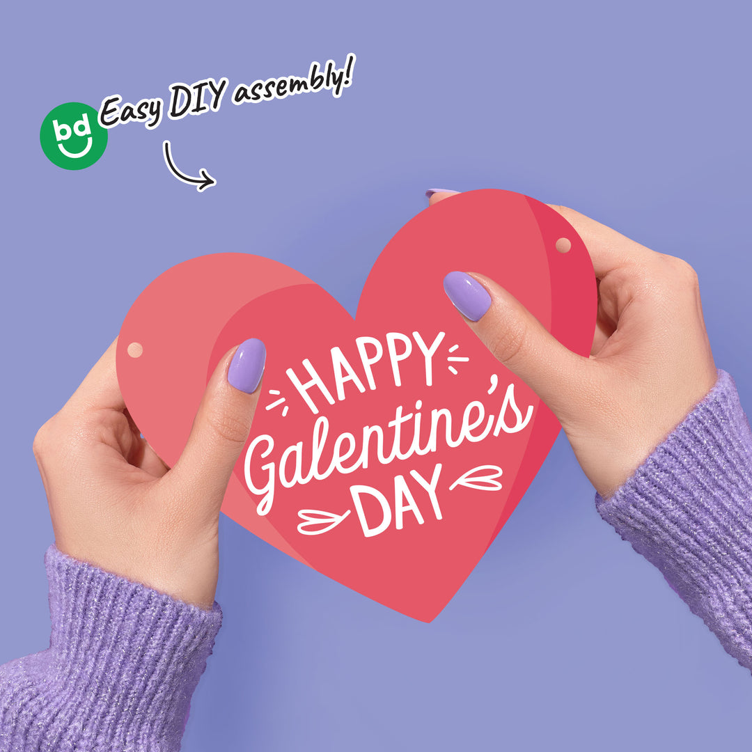 Close-up of double-sided heart cutouts from Galentine’s Day banner
