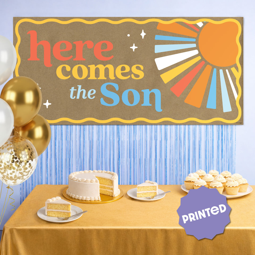 Sunshine baby shower banner styled above gift table