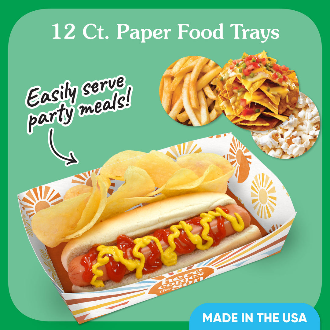 Paper food trays with a hot dog, chips, and nachos on a green background with text about serving baby shower party meals.