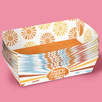 Stack of paper food trays with 'here comes the son' text 