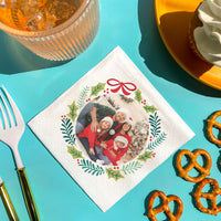 Custom Napkin with a festive design featuring a family photo on a blue table with food items.