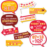 A set of 10 printed photo booth props in red and gold colors with football-themed phrases and props.