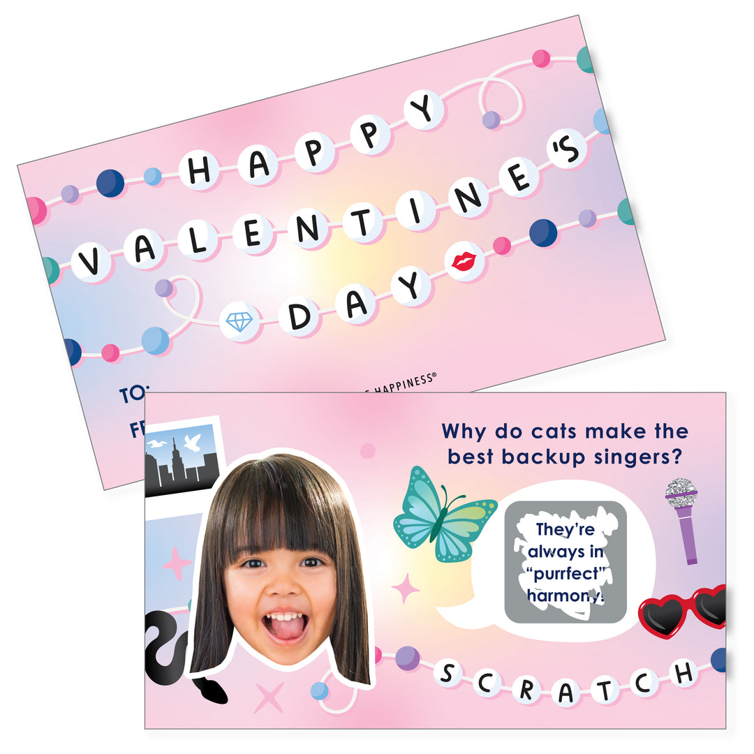 A set of Personalized Valentine's Day scratch-off cards with 'Happy Valentine's Day' text, pop-star themed jokes, and a custom photo cutout. The cards are pink with colorful decorations and have a 'Why do cats make the best backup singers? They're always in perfect harmony.