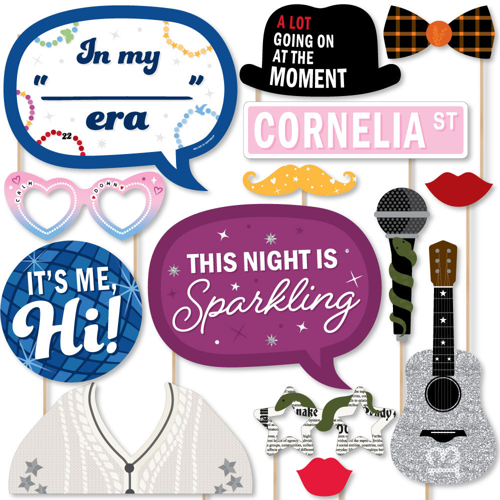 A collection of colorful party photo booth props including signs, glasses, bow ties, lips, mustaches, and other party accessories.
