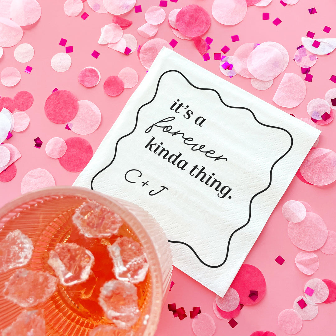 Card with 'it's a forever kinda thing' text on a pink background with confetti and a drink.
