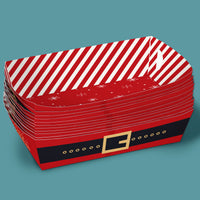 Stack of red and white striped party trays with a Santa belt design on a teal background