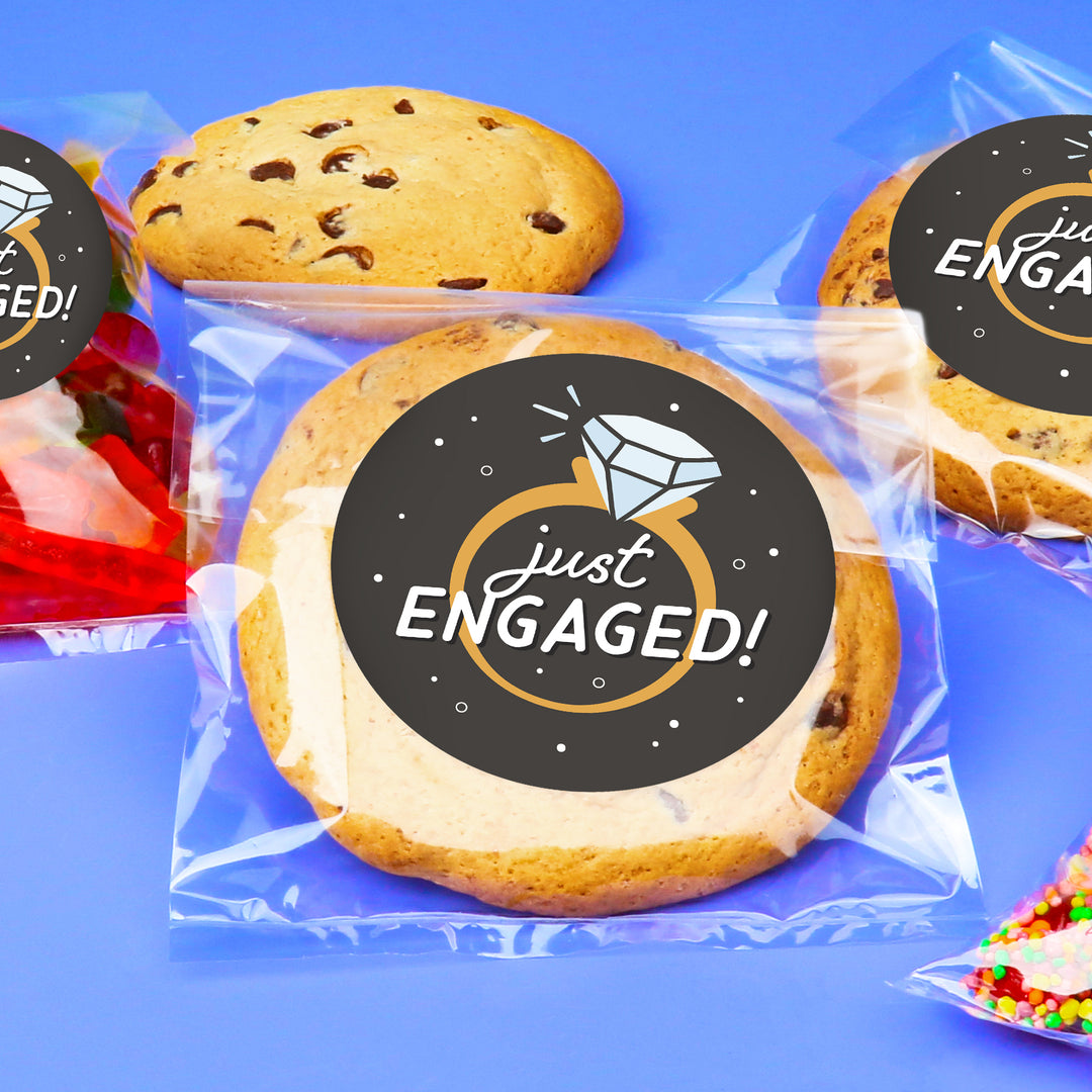 Cookies with 'just ENGAGED!' labels on a blue background
