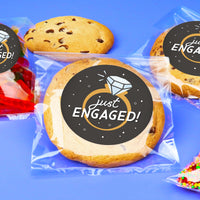 Cookies with 'just ENGAGED!' labels on a blue background