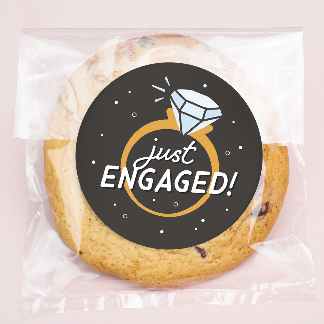Cookie with 'Just Engaged!' label on a pink background