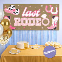Pink cowgirl Last Rodeo banner at Nashville girls weekend