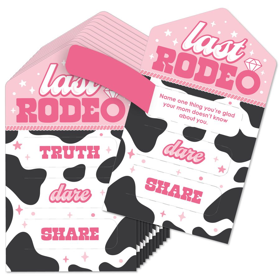 A set of 'Last Rodeo' bachelorette party game cards with 'Truth, Dare, Share' text and a pink cowgirl theme, including pull tabs.