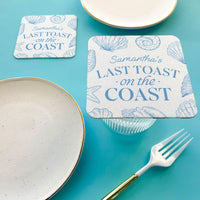 Coasters with 'Samantha's Last Toast on the Coast' custom text on a blue background with seashell designs.