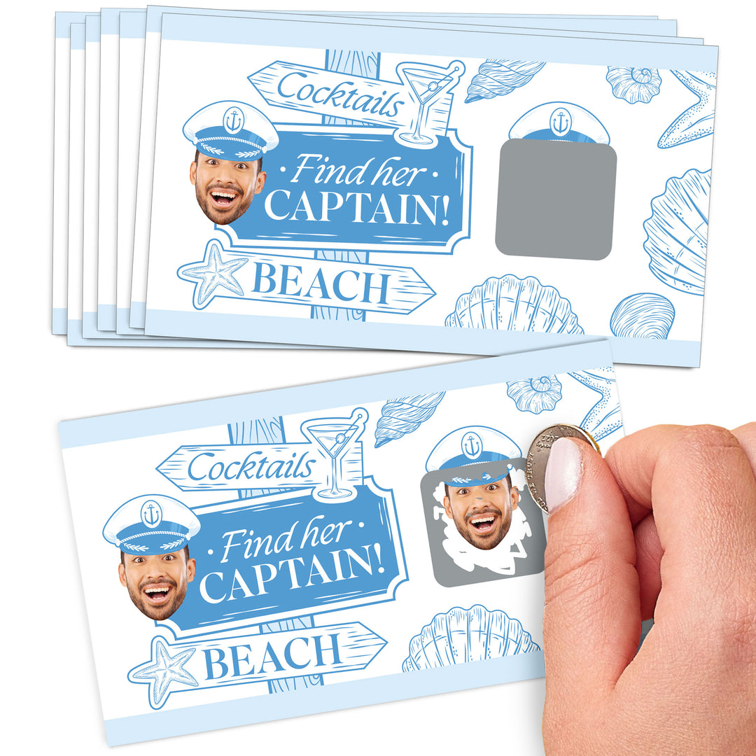 A hand holding a scratch-off card game with a beach and cocktails theme, titled 'Find her Captain!'. The card shows a face hidden under a scratch-off layer and is labeled with 'Cocktails' and 'Beach'.