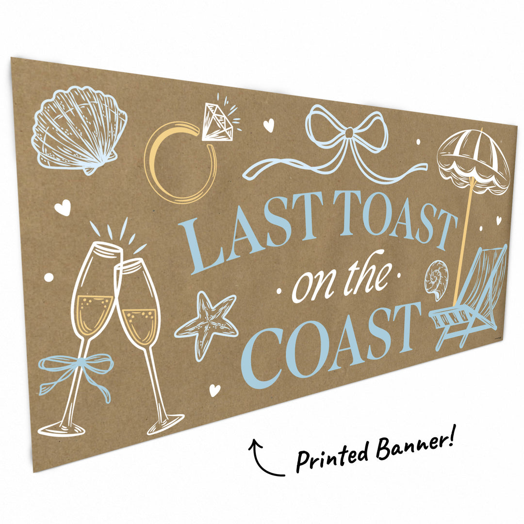Close-up of seashells, champagne glasses, and bow on coastal banner
