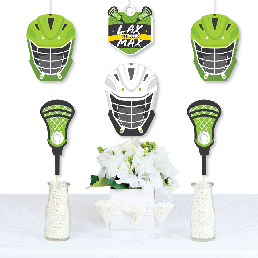 A set of paper die-cut decorations for a lacrosse theme, including shapes of a helmet, stick, and shield, displayed as wall hangings and centerpieces at a party.