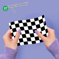 Close-up of checkered flag and race car banner pieces