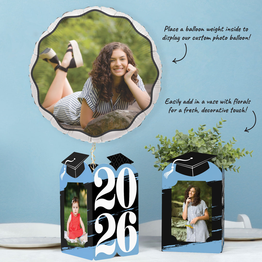 Light blue graduation party table with photo holder decor