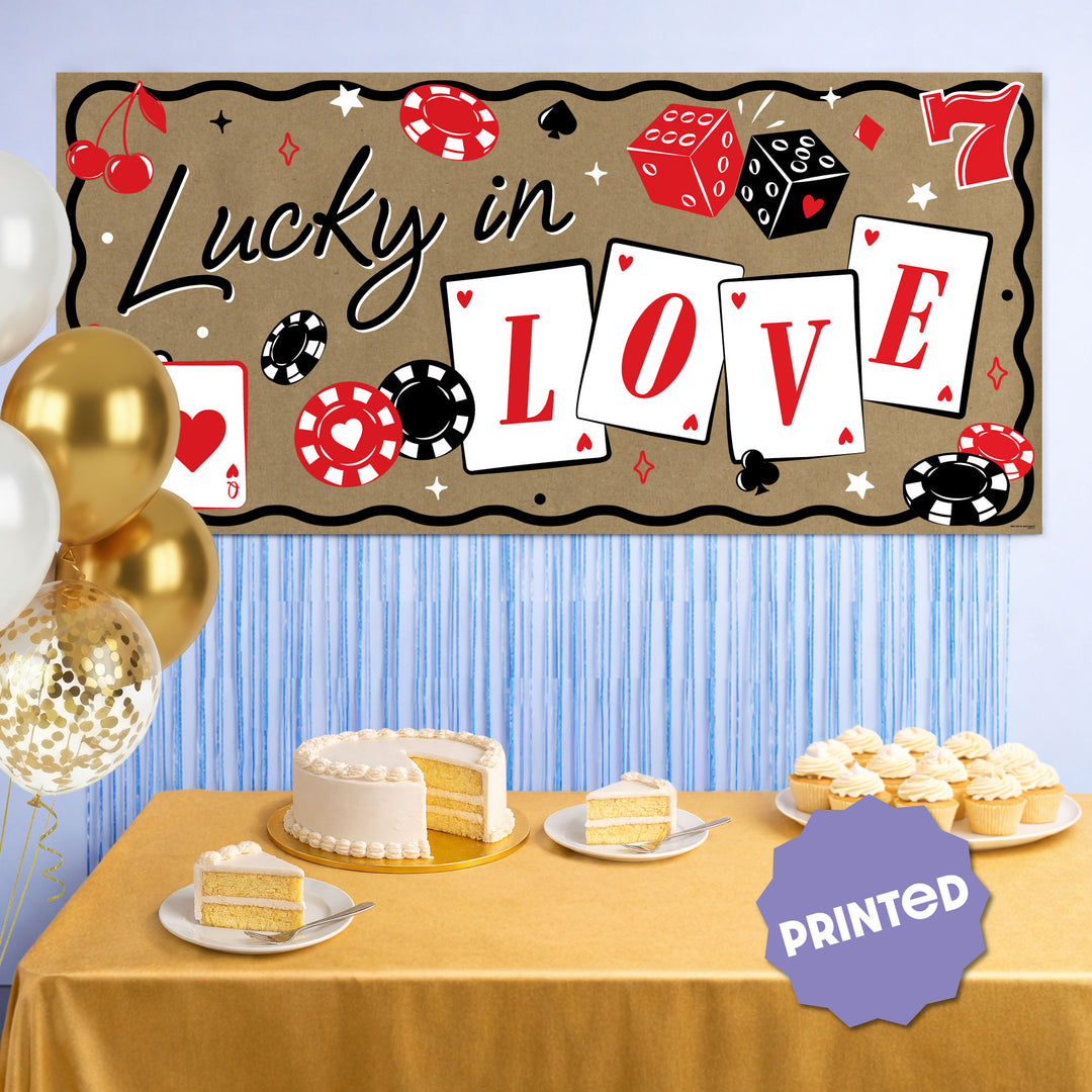 Vegas themed Lucky in Love banner above dessert table