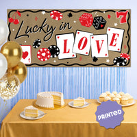 Vegas themed Lucky in Love banner above dessert table