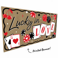 Close-up of playing cards, dice, and poker chips on casino banner