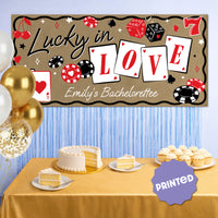 Vegas themed bachelorette banner styled behind dessert table