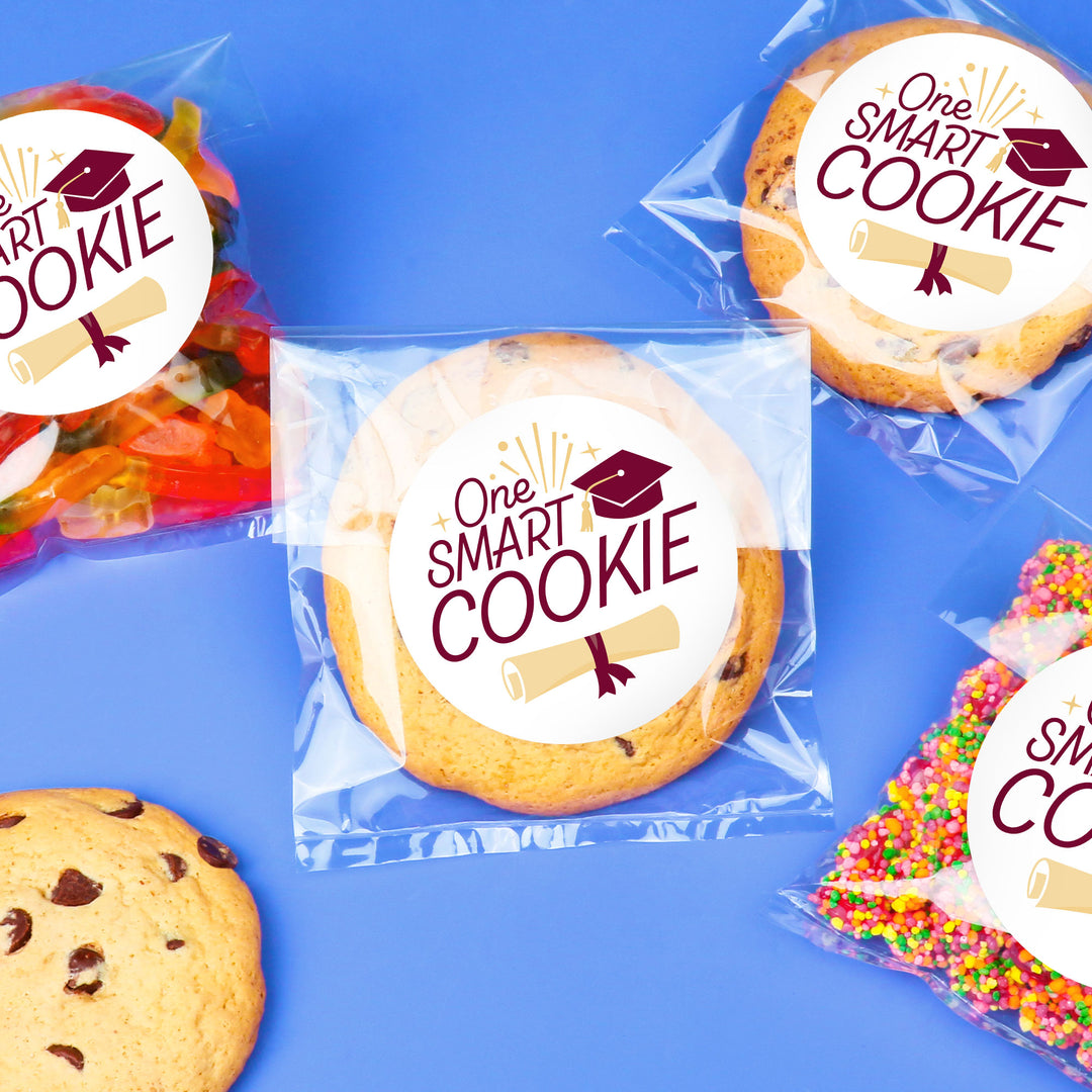 Maroon graduation cookie favors on party table