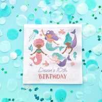 Girl's Birthday napkin with mermaid design on a blue background with confetti