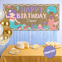 Ocean-themed mermaid banner styled as birthday party backdrop
