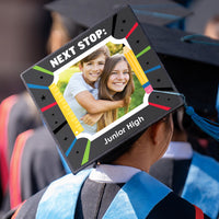 Graduation ceremony cap with school themed topper