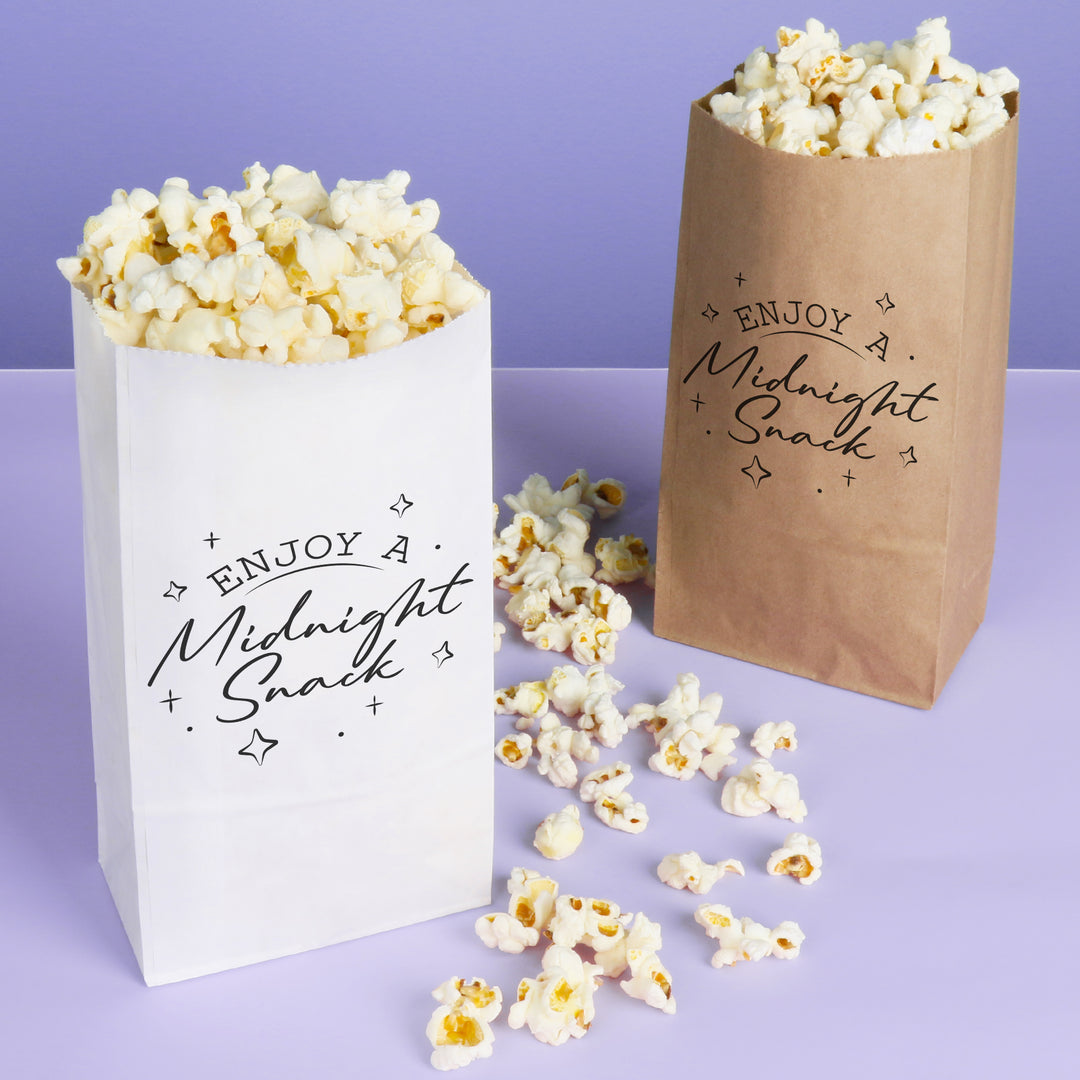 Two popcorn bags with 'Enjoy a Midnight Snack' text on a purple background