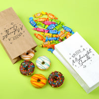 Donuts, candy, and a bag with 'Enjoy a Midnight Snack' text on a green background