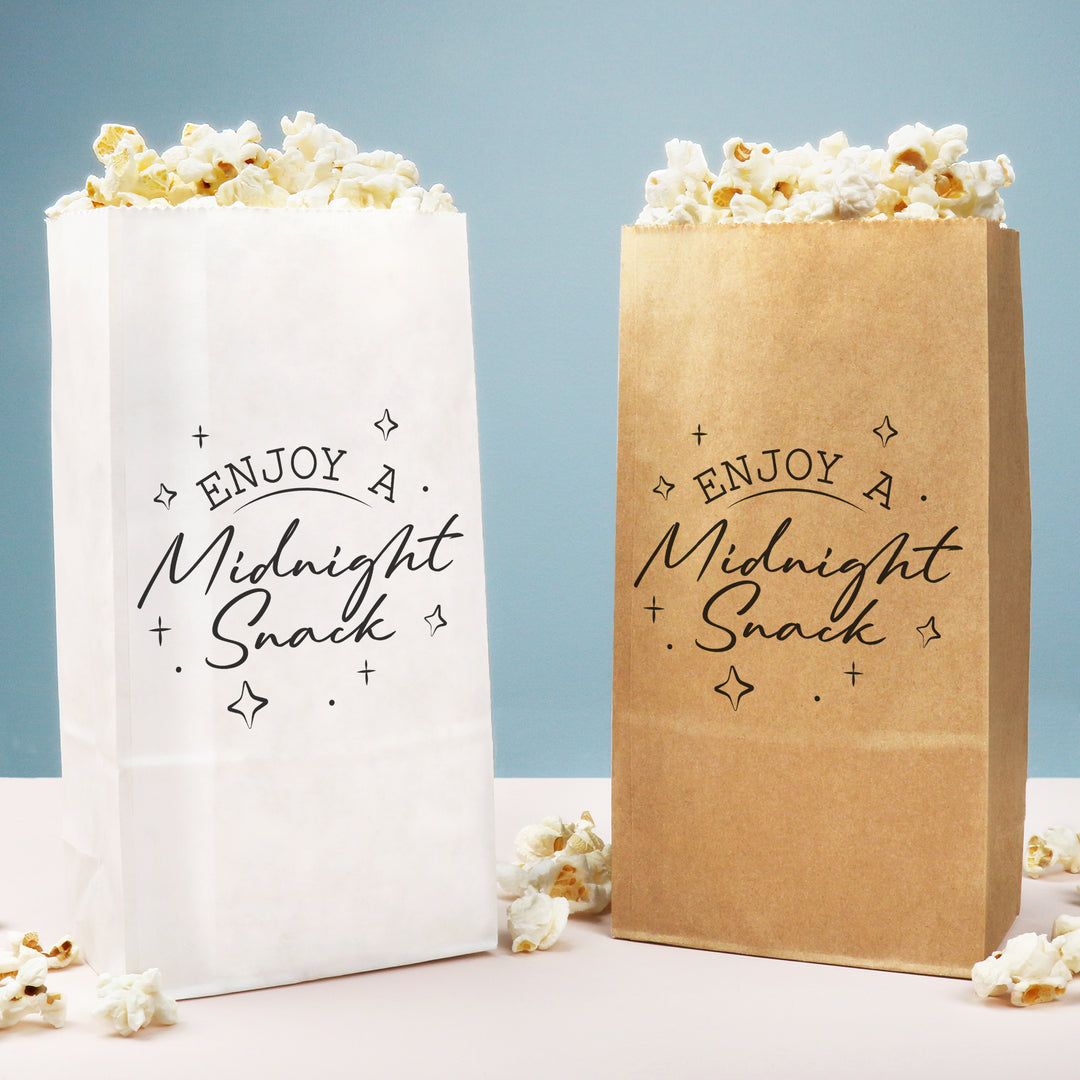 Two bags of popcorn, one white and one brown, with 'Enjoy a Midnight Snack' text on a light blue background.