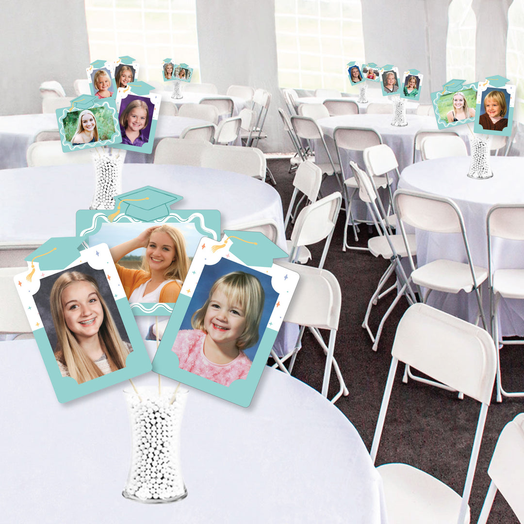 Graduation table decor with pastel photo toppers