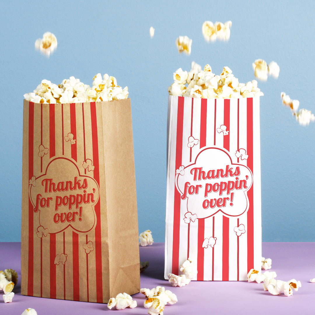 Two popcorn bags with red and white stripes and 'Thanks for poppin' over!' text, surrounded by popcorn on a blue and purple gradient background.