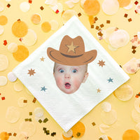 Baby wearing a cowboy hat on a custom decorative napkin with confetti on a yellow background 1st Birthday