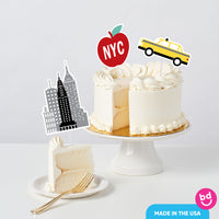 New York themed party cake with city toppers