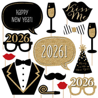 New Year's Eve photo booth props including glasses, hats, and text on a white background