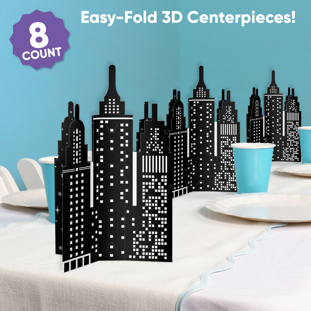 Black cityscape 3D centerpieces on a table with a blue background