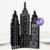 A set of 8 black and white 3D city skyline table centerpieces made from cardstock.