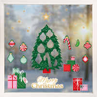 Decorative Christmas window sticker set with tree, presents, and ornaments on a glass background.