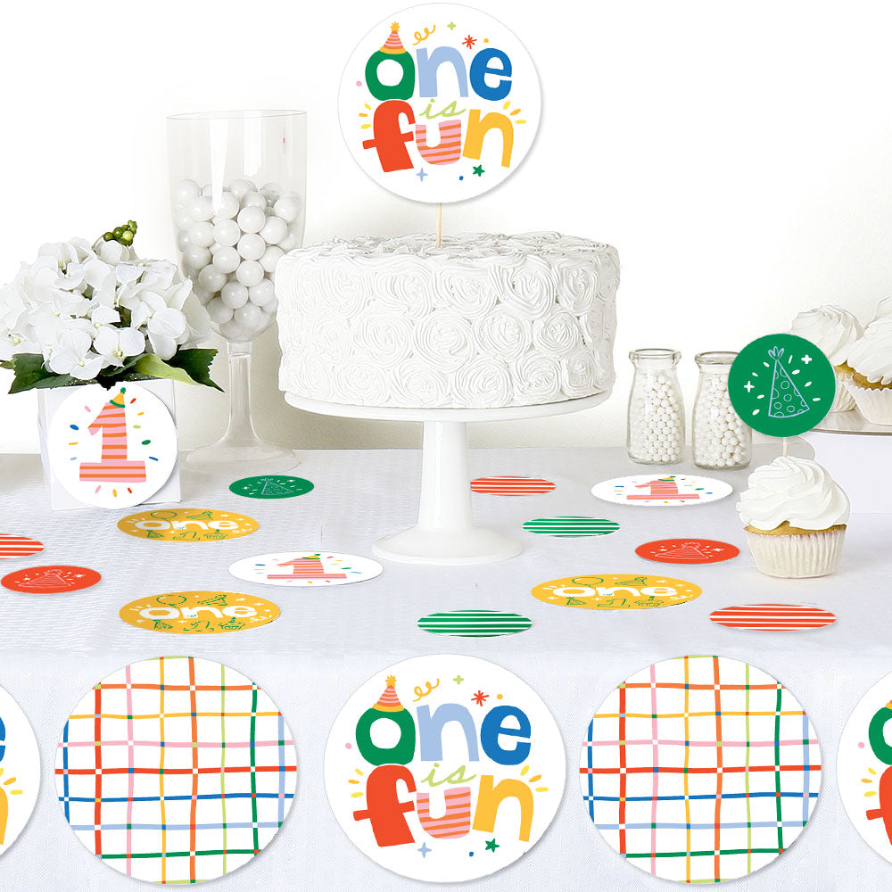 One is Fun First birthday party setup with cake, decorations, and 'one is fun' topper.