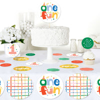 One is Fun First birthday party setup with cake, decorations, and 'one is fun' topper.