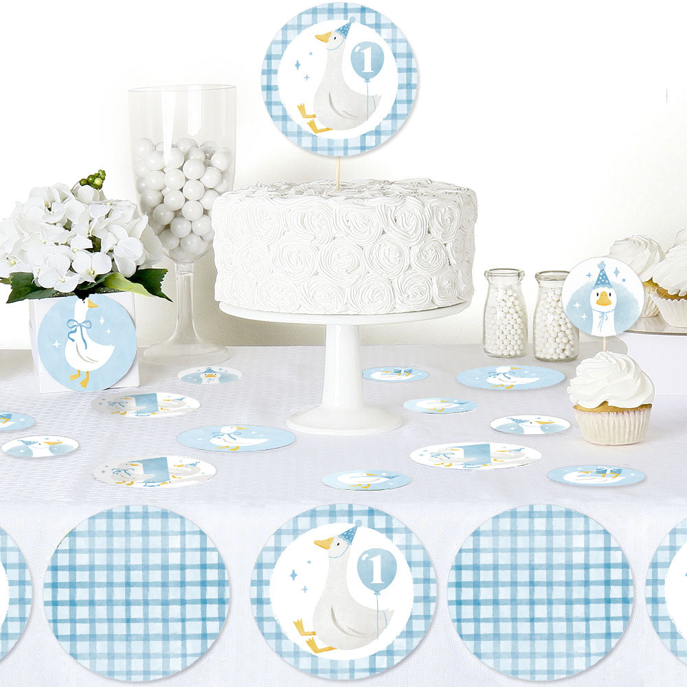 One Silly Goose blue confetti scattered on boy’s first birthday dessert table