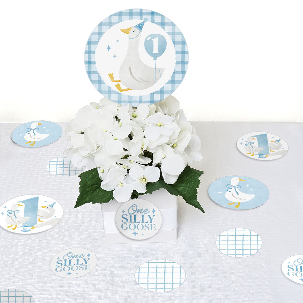 One Silly Goose blue confetti scattered on boy’s first birthday dessert table