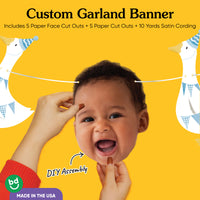 Baby photo face cutout with blue goose illustration close-up