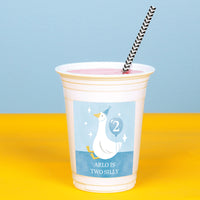 Close-up of blue goose sticker applied to white plastic cup