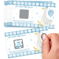 Scratch-off game cards with a goose design and a hand scratching one of them.