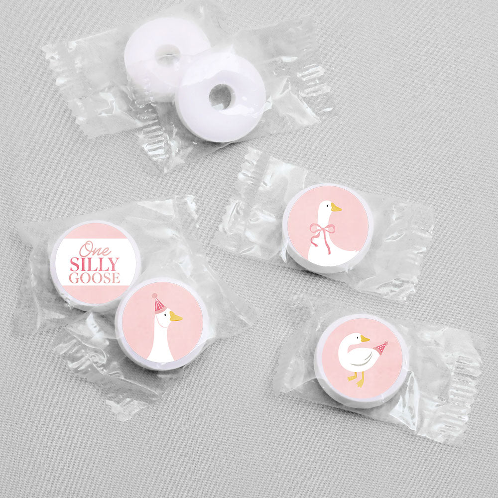 Small round stickers with 'One Silly Goose' design in clear packaging on a gray background