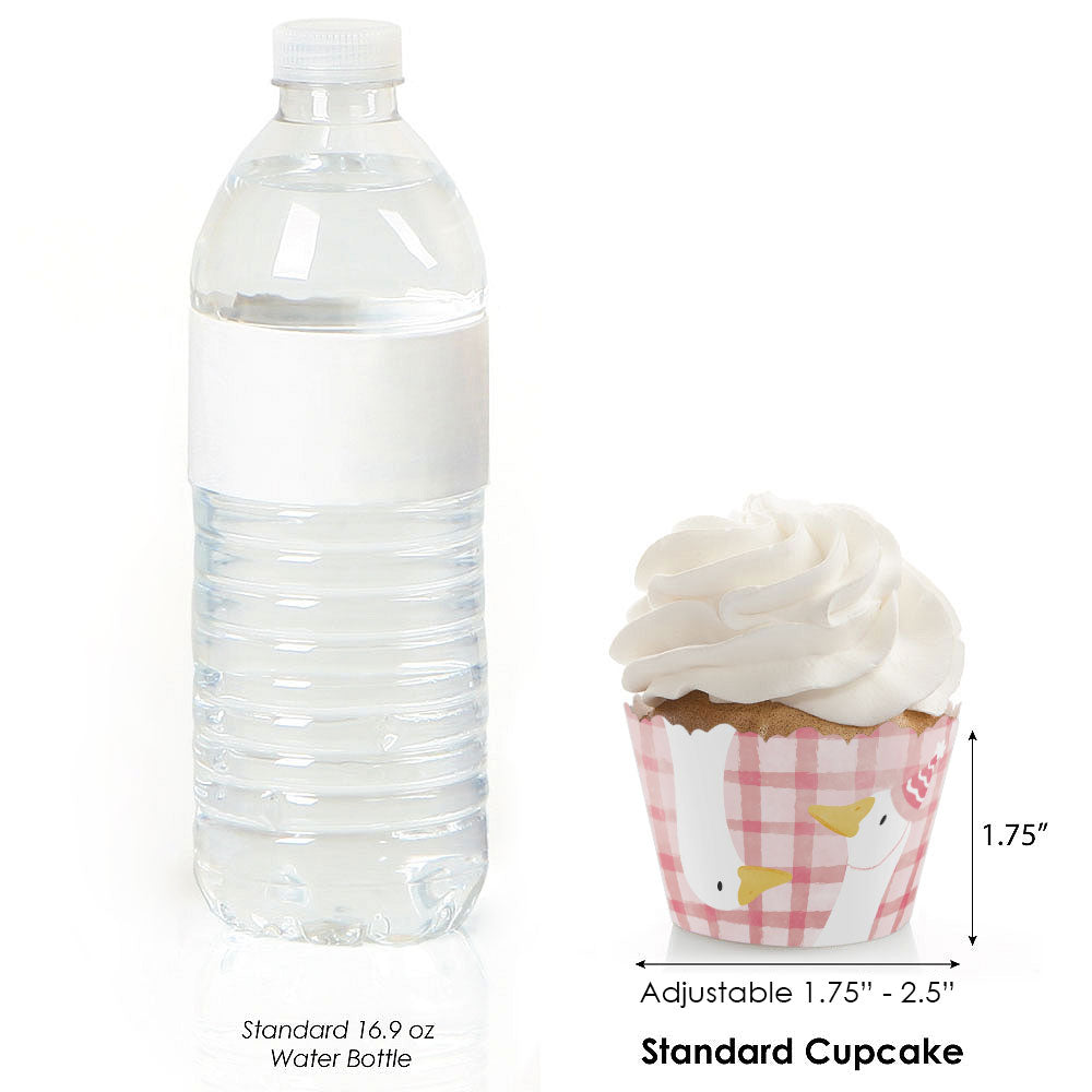 Standard 16.9 oz water bottle next to a cupcake with a pink wrapper, showing size comparison.